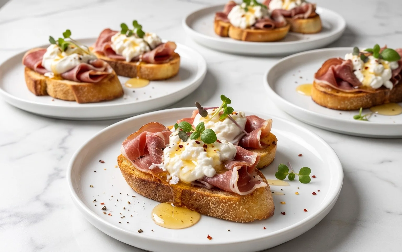 Beef Prosciutto Crostini with Burrata and Lemon Honey Drizzle